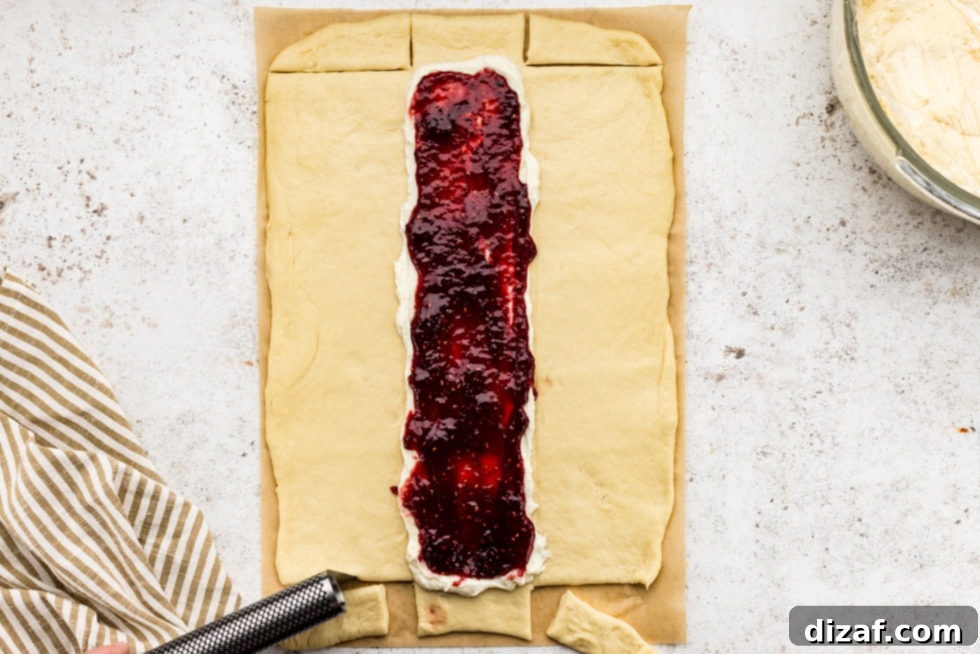 strips cut from sides of dough to make braids