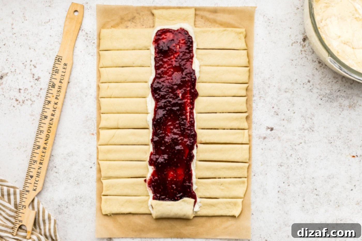 strips cut out on sides of dough along the filling lines