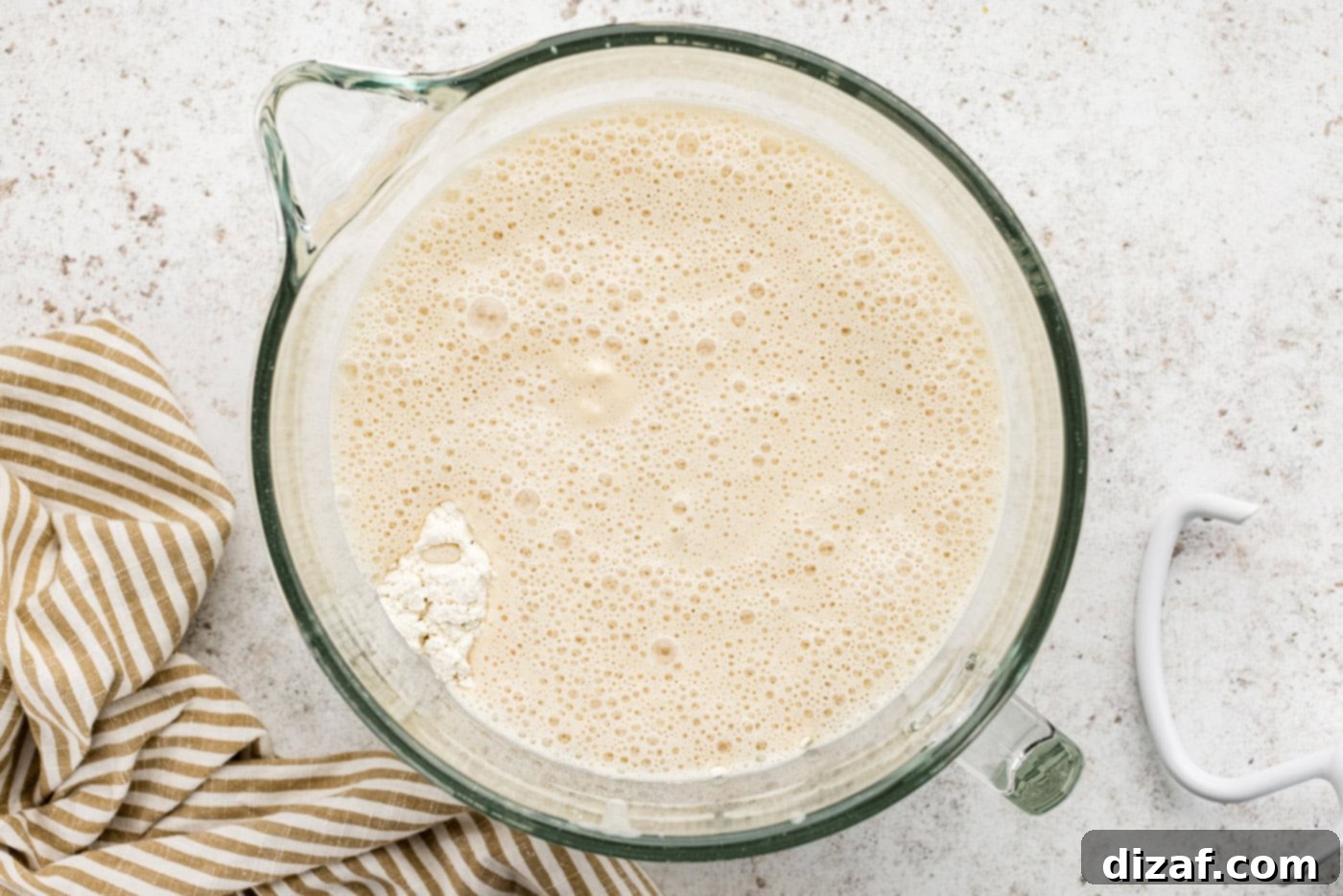dry ingredients, wet ingredients, and sponge in a stand mixer bowl