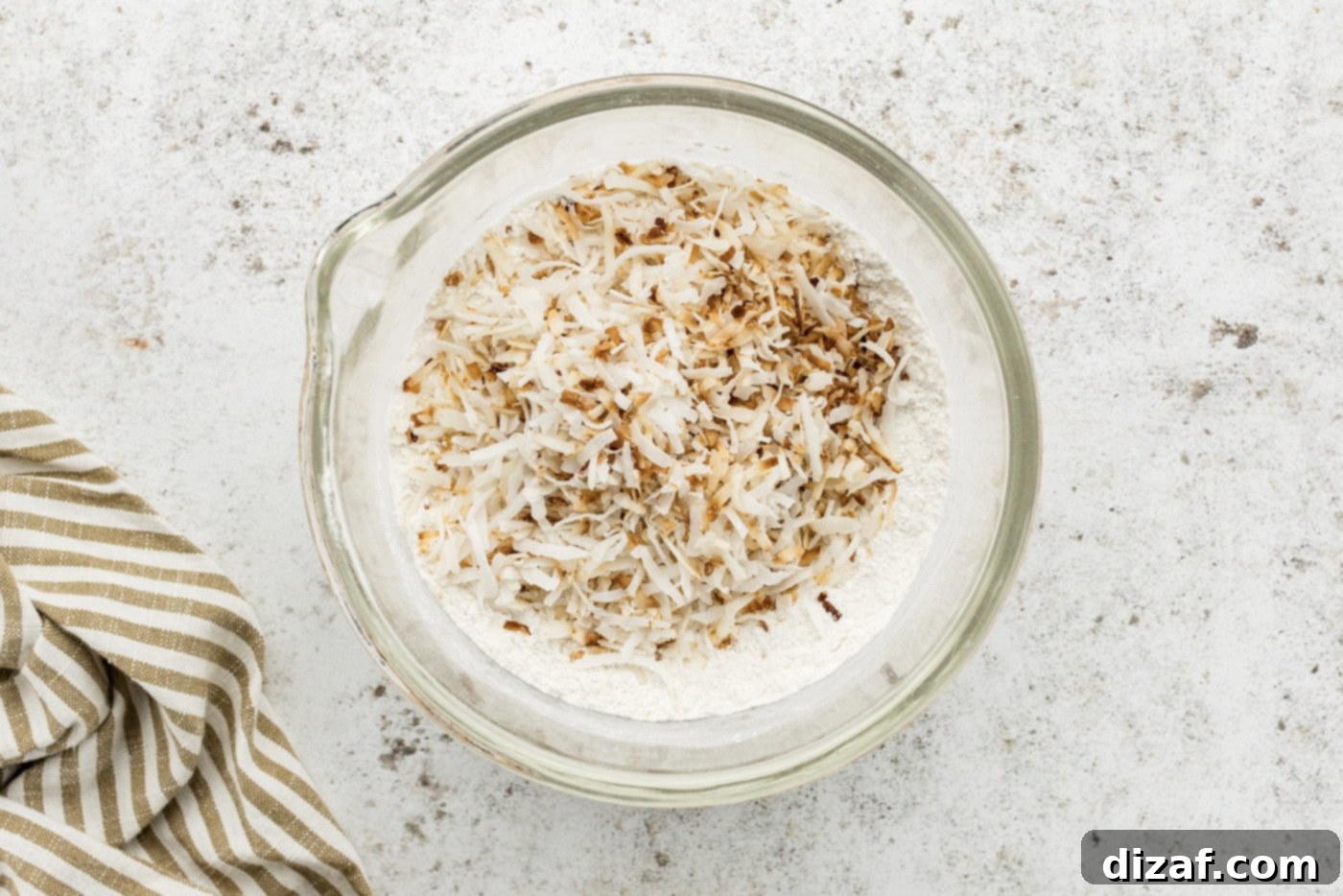 Toasted coconut added to flour and salt mixture