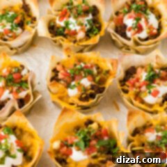 Close up photo of Taco Cups resting on parchment paper