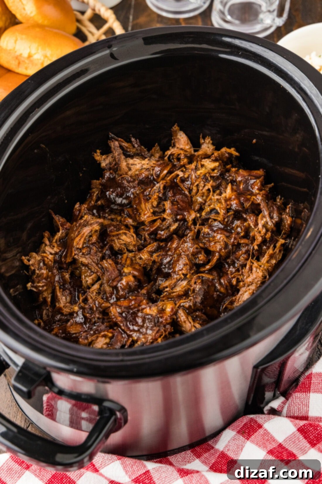 Slow-Cooker BBQ Shredded Beef Sandwiches 2 Crockpot filled with Crockpot BBQ Beef
