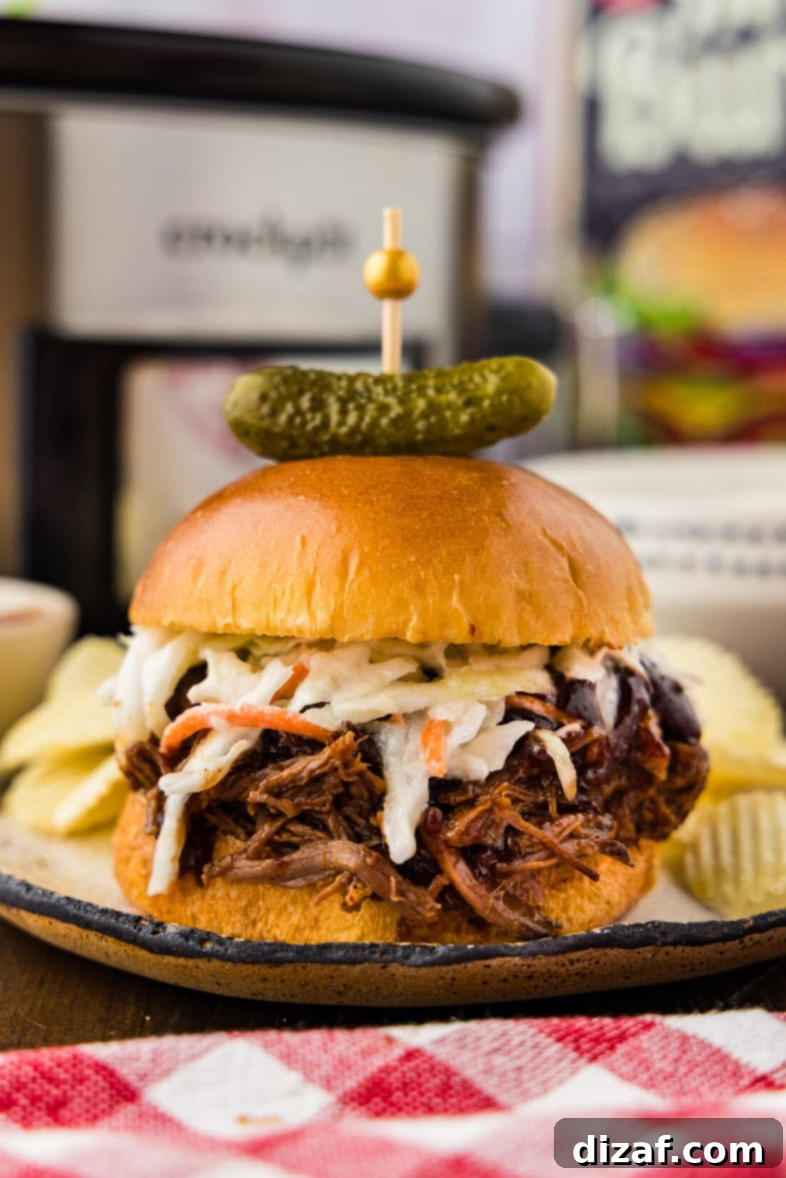 Slow-Cooker BBQ Shredded Beef Sandwiches 8 Crockpot BBQ Beef Sandwiches plated with potato chips