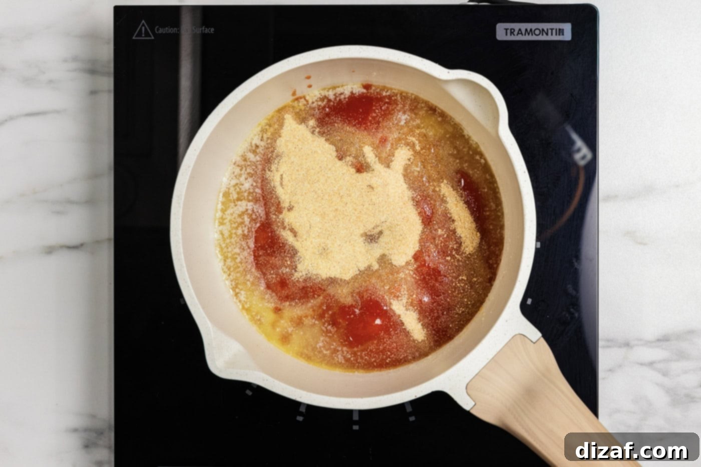 Making buffalo sauce in a saucepan