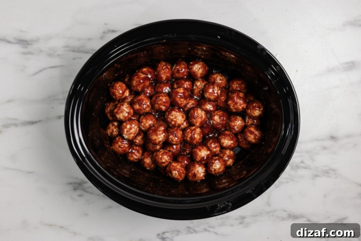 Barbecue coated meatballs in a crockpot