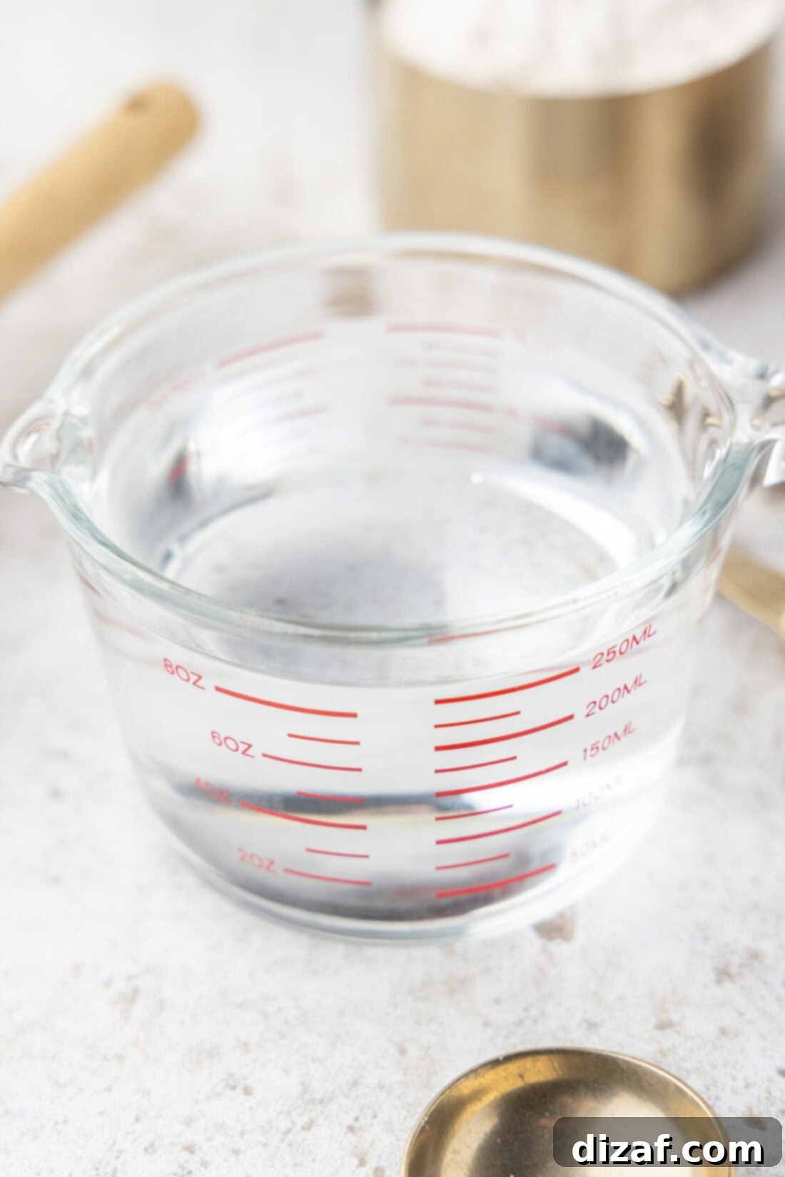 Eight Ounces: More Than Meets the Measuring Cup 3 Close-up of a liquid measuring cup showing fluid ounce and cup measurements.