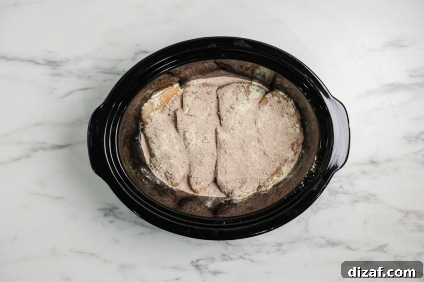 Au just packet sprinkled over ranch seasoning and chicken breasts in a crockpot