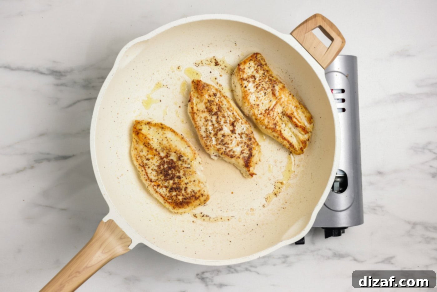 Garlic Chicken Pasta Sizzling Garlic Chicken Pasta Perfection 5 Chicken breasts cooked in a skillet with oil
